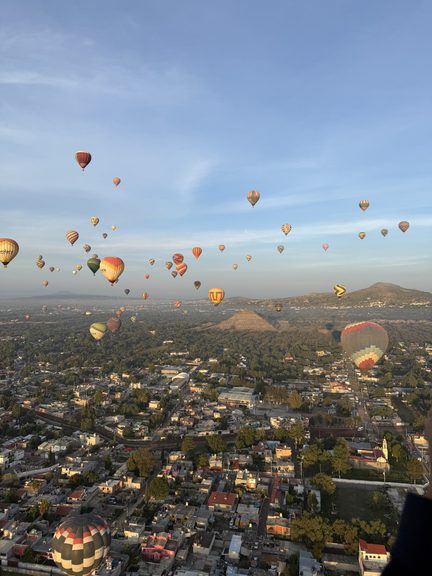 A sunrise hot air balloon flight over the ancient Teotihuacán pyramids near Mexico City, a top-rated activity for a refined weekend itinerary.