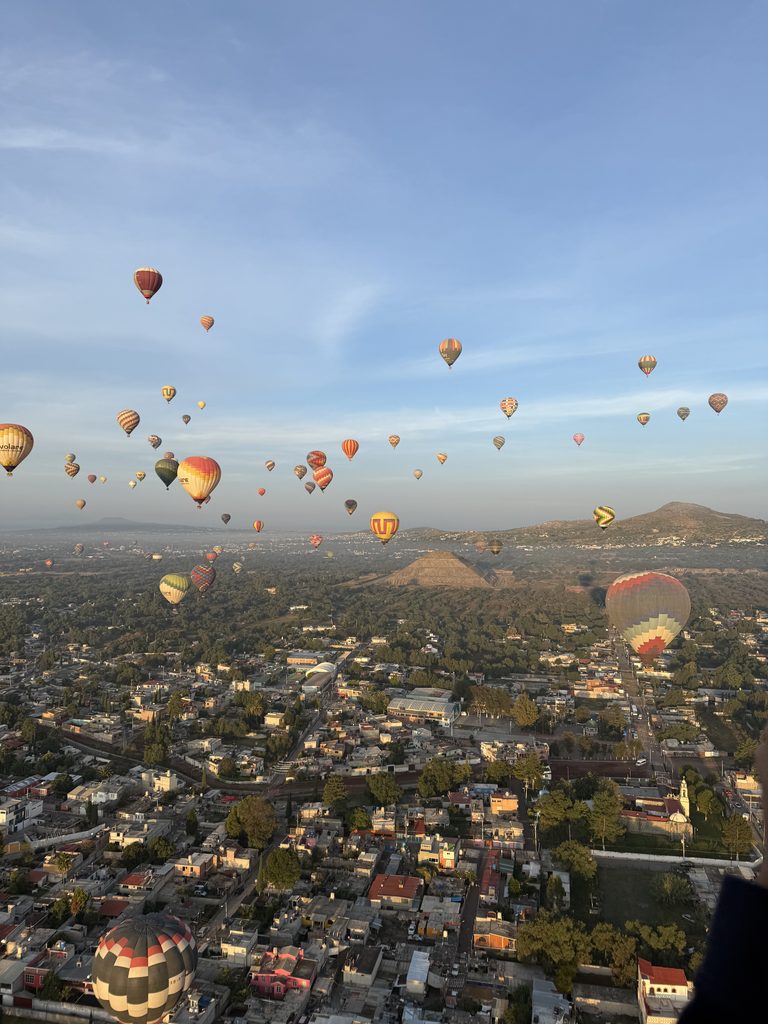 A sunrise hot air balloon flight over the ancient Teotihuacán pyramids near Mexico City, a top-rated activity for a refined weekend itinerary.