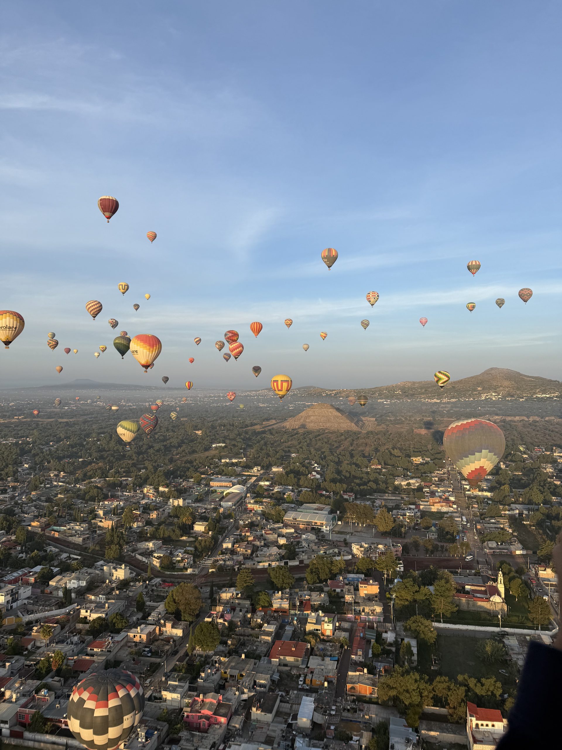A sunrise hot air balloon flight over the ancient Teotihuacán pyramids near Mexico City, a top-rated activity for a refined weekend itinerary.
