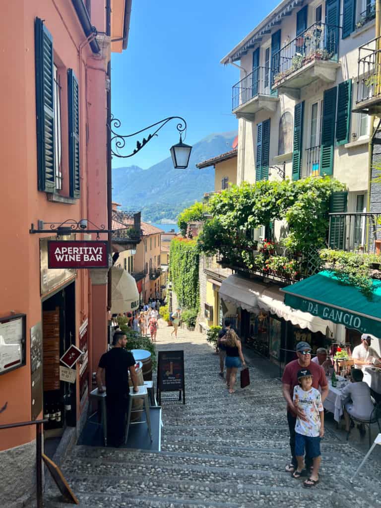 Looking down a picturesque but crowded street in Bellagio, Italy during the peak June travel season.