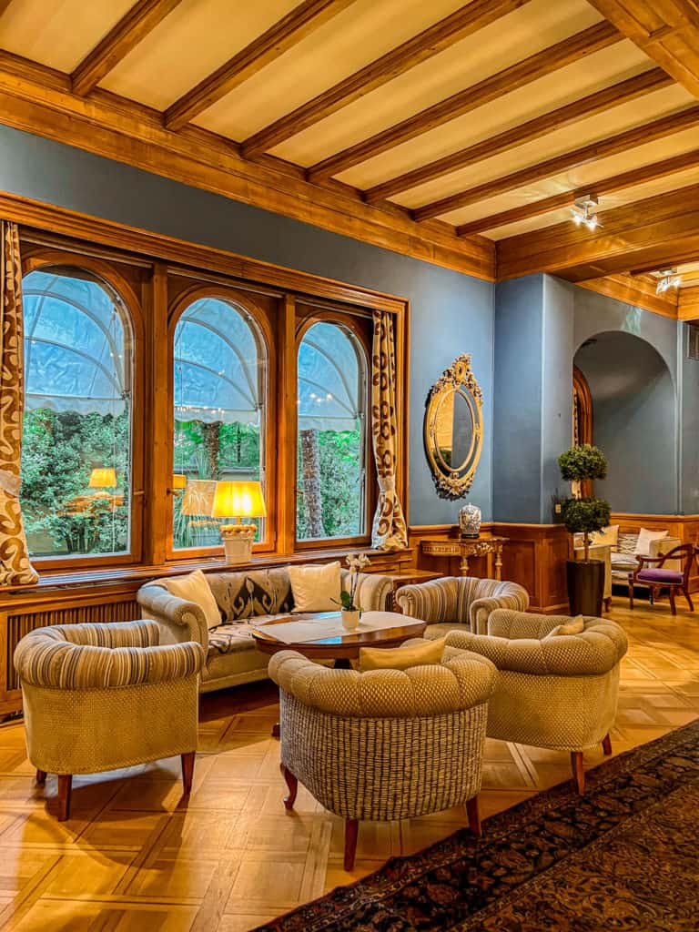 Sophisticated old-world interior lounge with classic European decor at Grand Hotel Villa Castagnola.