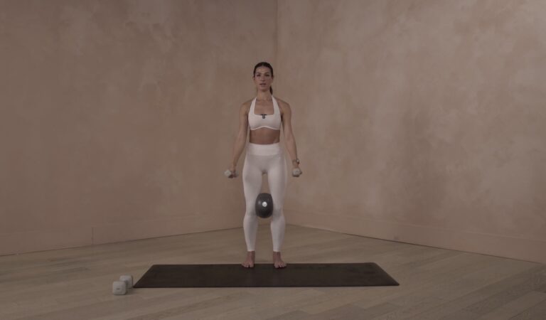 Lia Bartha demonstrating a form-focused Pilates movement during a B The Method workout session.