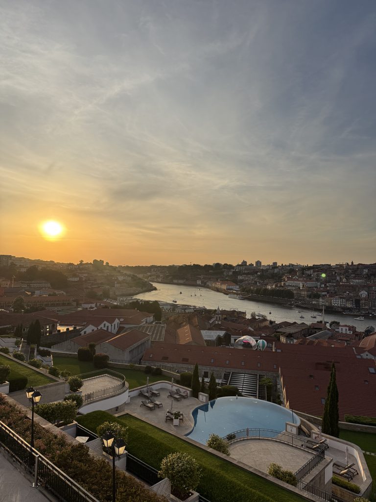 Sunset view over the Douro River in Porto, Portugal, from the decanter-shaped outdoor pool at The Yeatman Hotel.